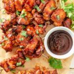 Juicy chicken skewers with a crispy crust, ready for dipping in BBQ sauce.