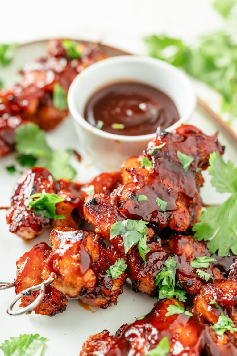 Oven-roasted chicken skewers with a sprinkle of parsley