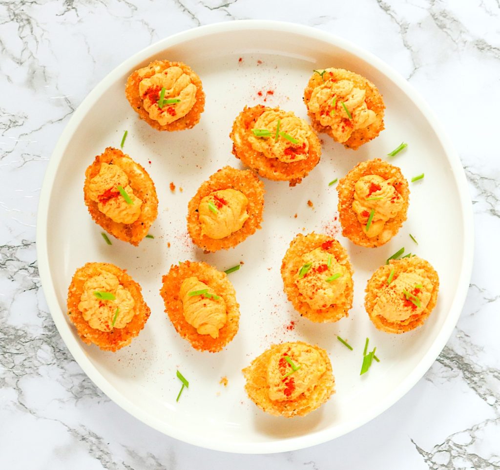 A plate of freshly fried and stuffed deviled eggs