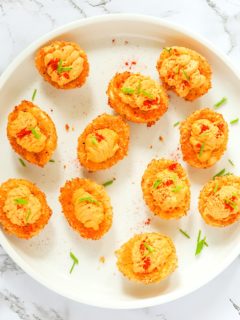 A plate of freshly fried and stuffed deviled eggs