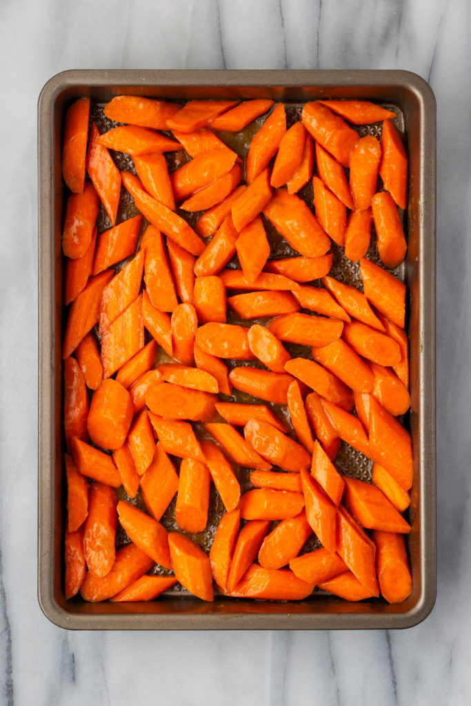 Overhead view of brown sugar glazed carrots in pan