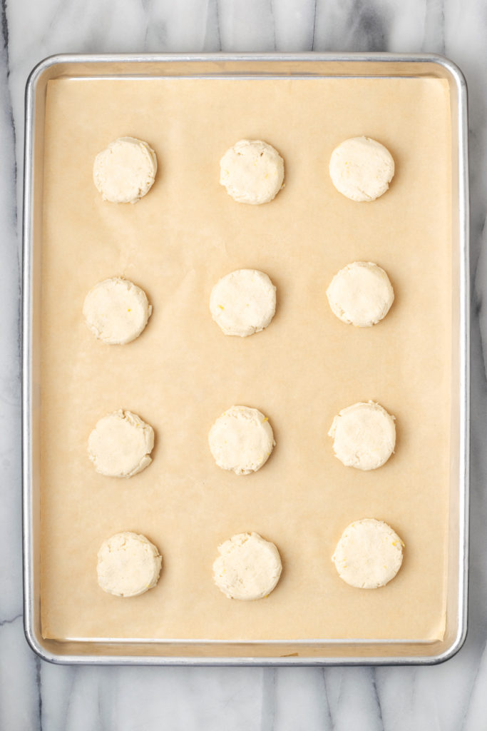 Overhead view of unbaked lemon cookies on baking sheet