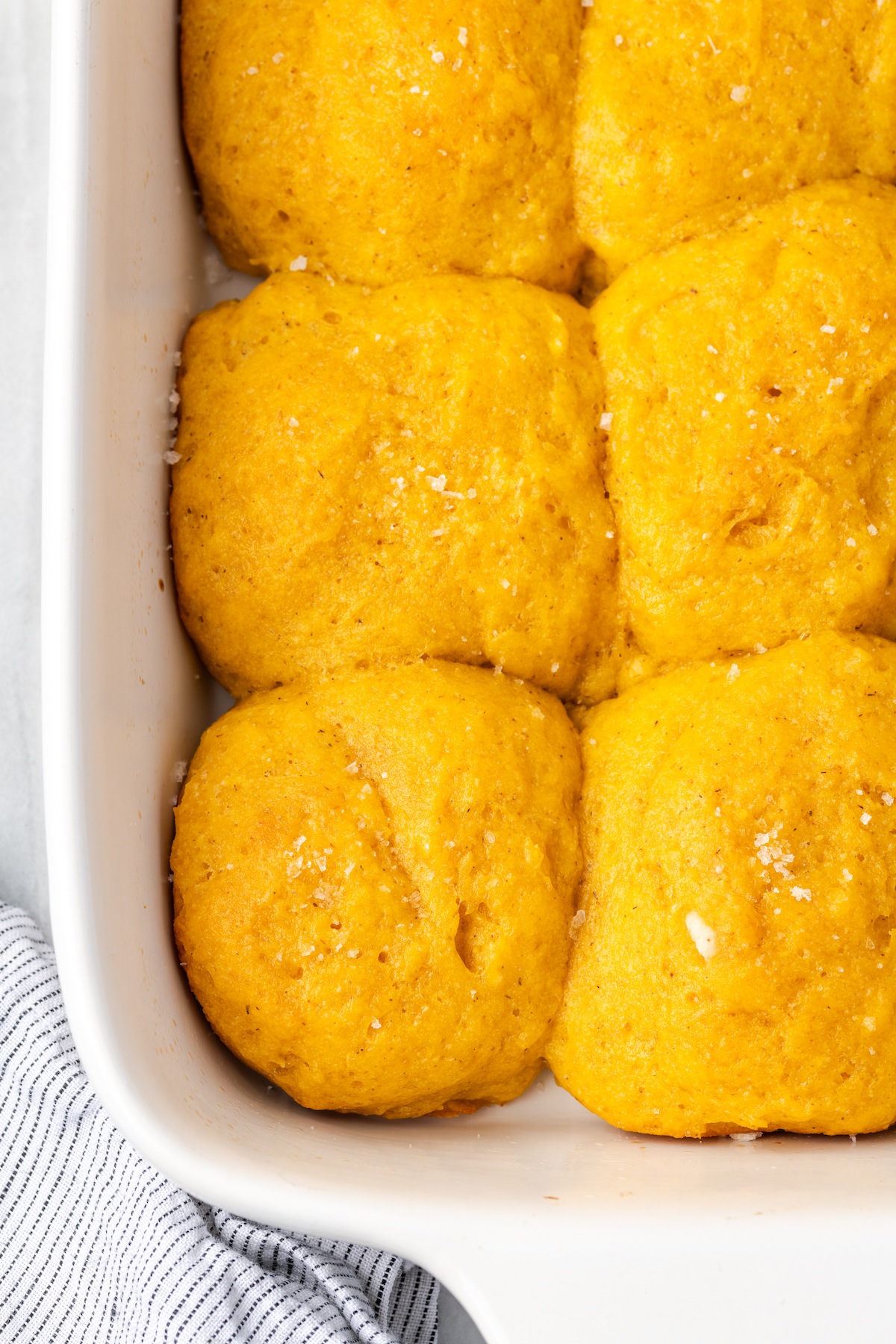 Overhead view of sweet potato rolls in baking dish