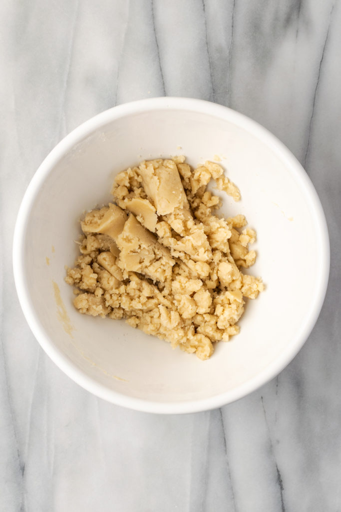 Overhead view of crust mixture in mixing bowl