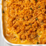 Top-down view of squash casserole in baking dish with breadcrumb topping