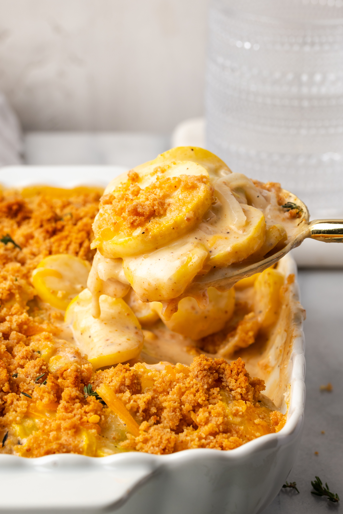 Spoonful of squash casserole over dish