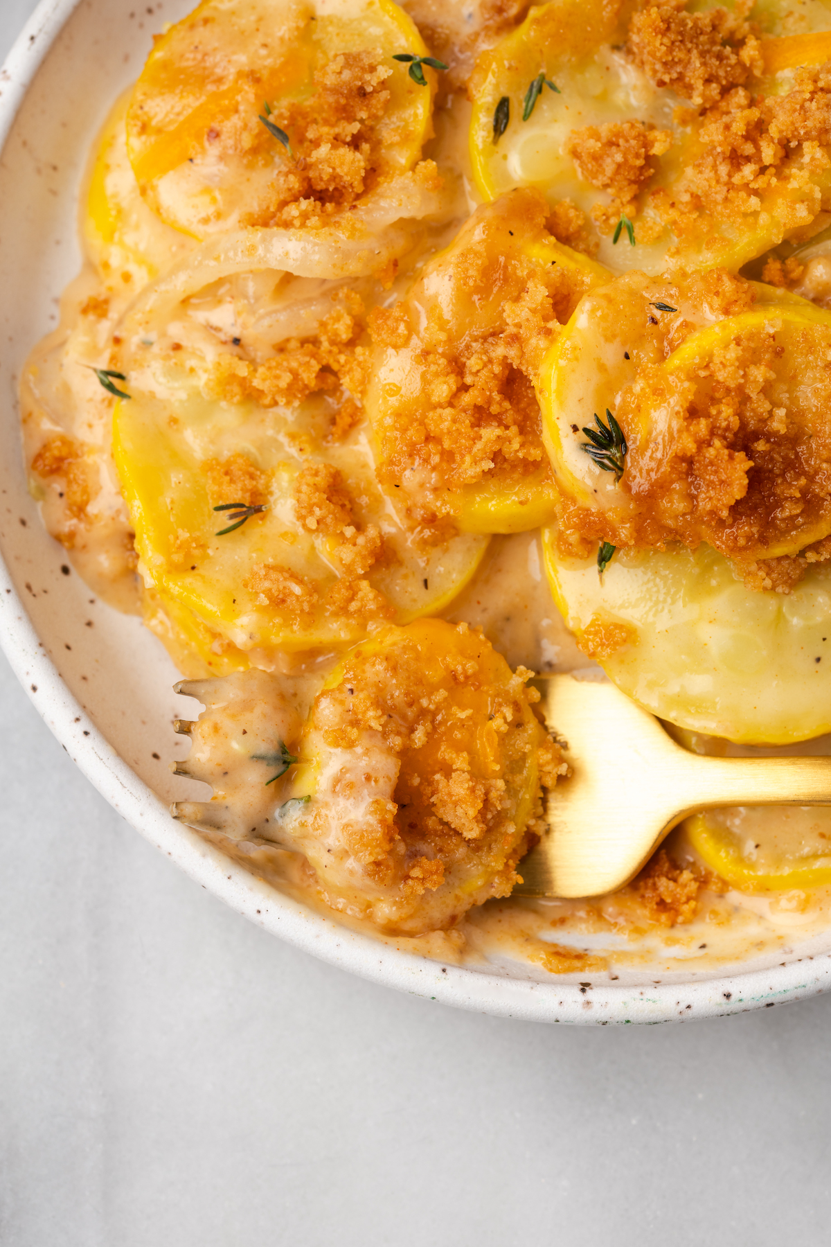 Bowl of squash casserole with fork